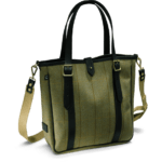 Was ist eine Tote Bag? 3 Eine in Olive-Farben gehaltene Helmsley Tweed Tote Bag im Bildvordergrund mit dunklen Leder Riemen und Griffen.