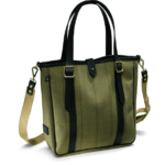 Eine in Olive-Farben gehaltene Helmsley Tweed Tote Bag im Bildvordergrund mit dunklen Leder Riemen und Griffen.